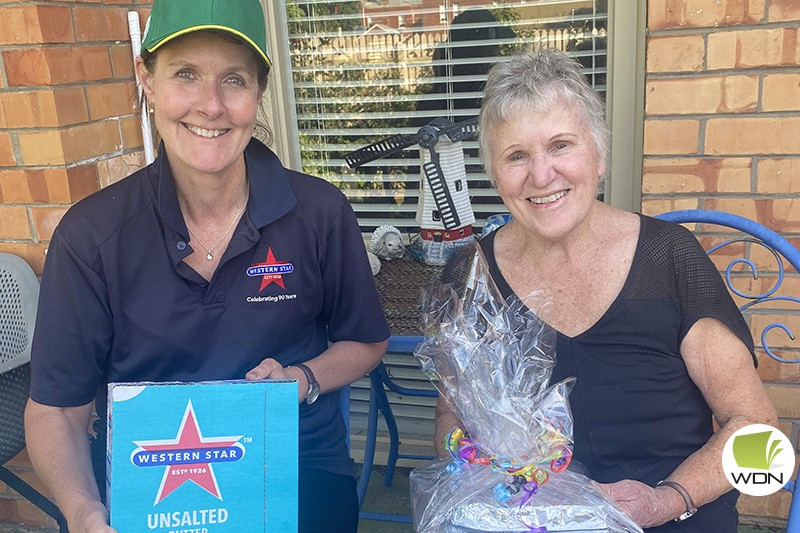 Donation appreciated: Fonterra Cobden’s Georgie Place drops off a donation of Western Star butter to Carole Manifold.