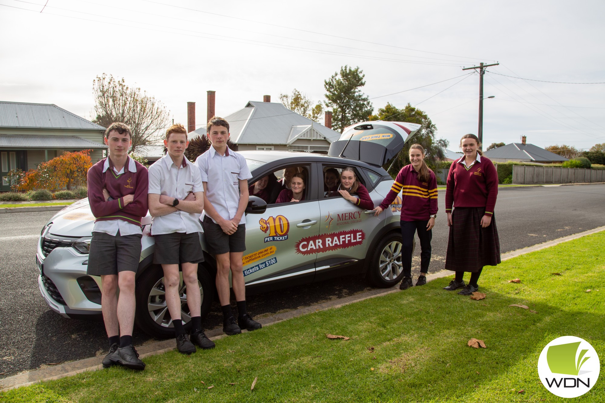 Tickets on sale: MRC students show off first prize in this year’s annual car raffle – a Renault Captur worth almost $35,000.