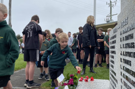 Students laid poppies as part of the service. 