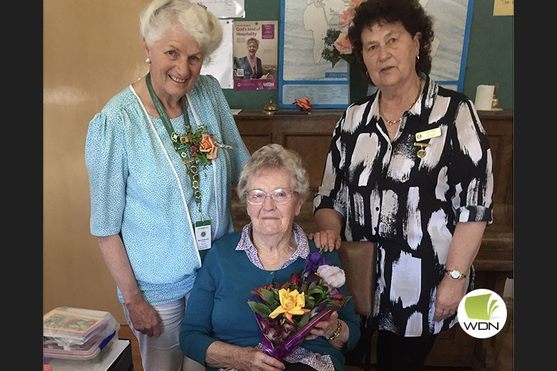 Farewell: CWA group president Bev Byron (left) with Cobden CWA branch president Nettie Hose (right) presents Doreen Sullivan with flowers for her 72 years’ involvement with the Cobden group.