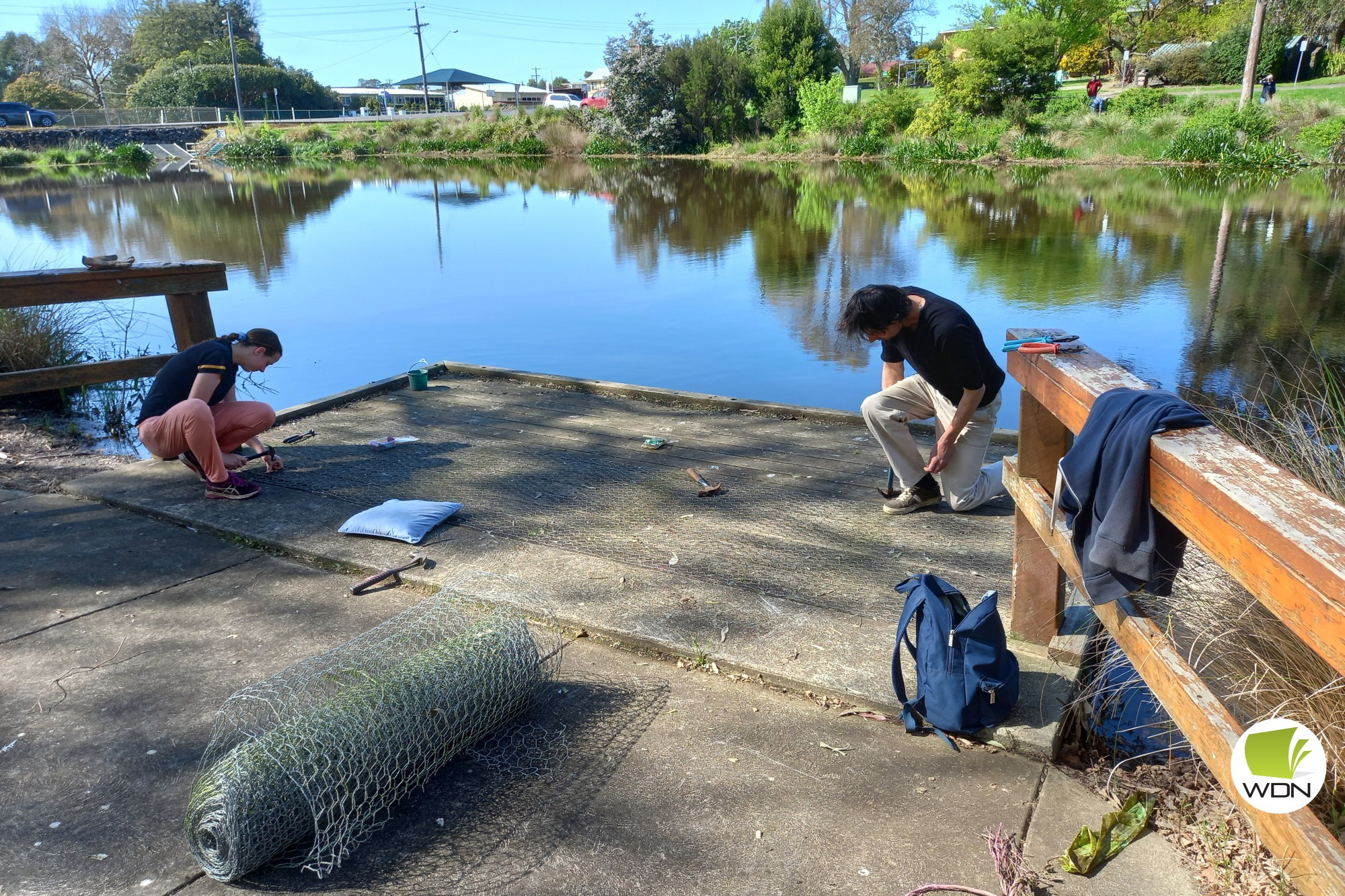 Helping out: Tabitha and Luke Perriss help out at a working bee at Lake Cobden over the weekend, with another working bee organised to complete the job.