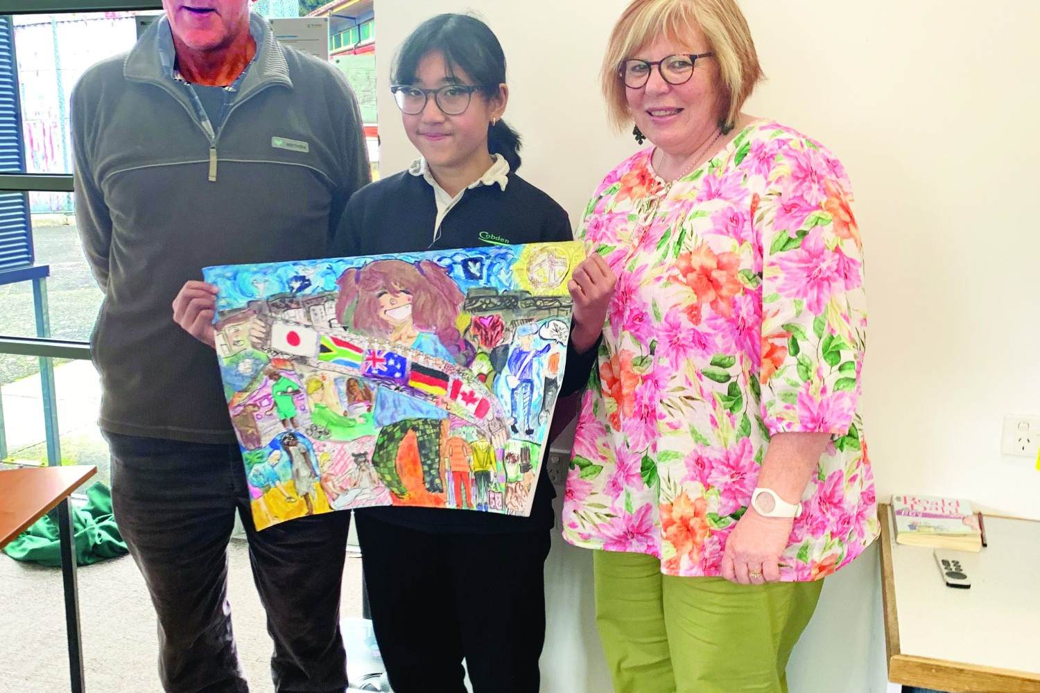 Judge Sue Stevens, Simpson and District Lions Club president John Morris and winner of the Peace Poster Competition from Cobden Nurul Hafizhah Sofyan.