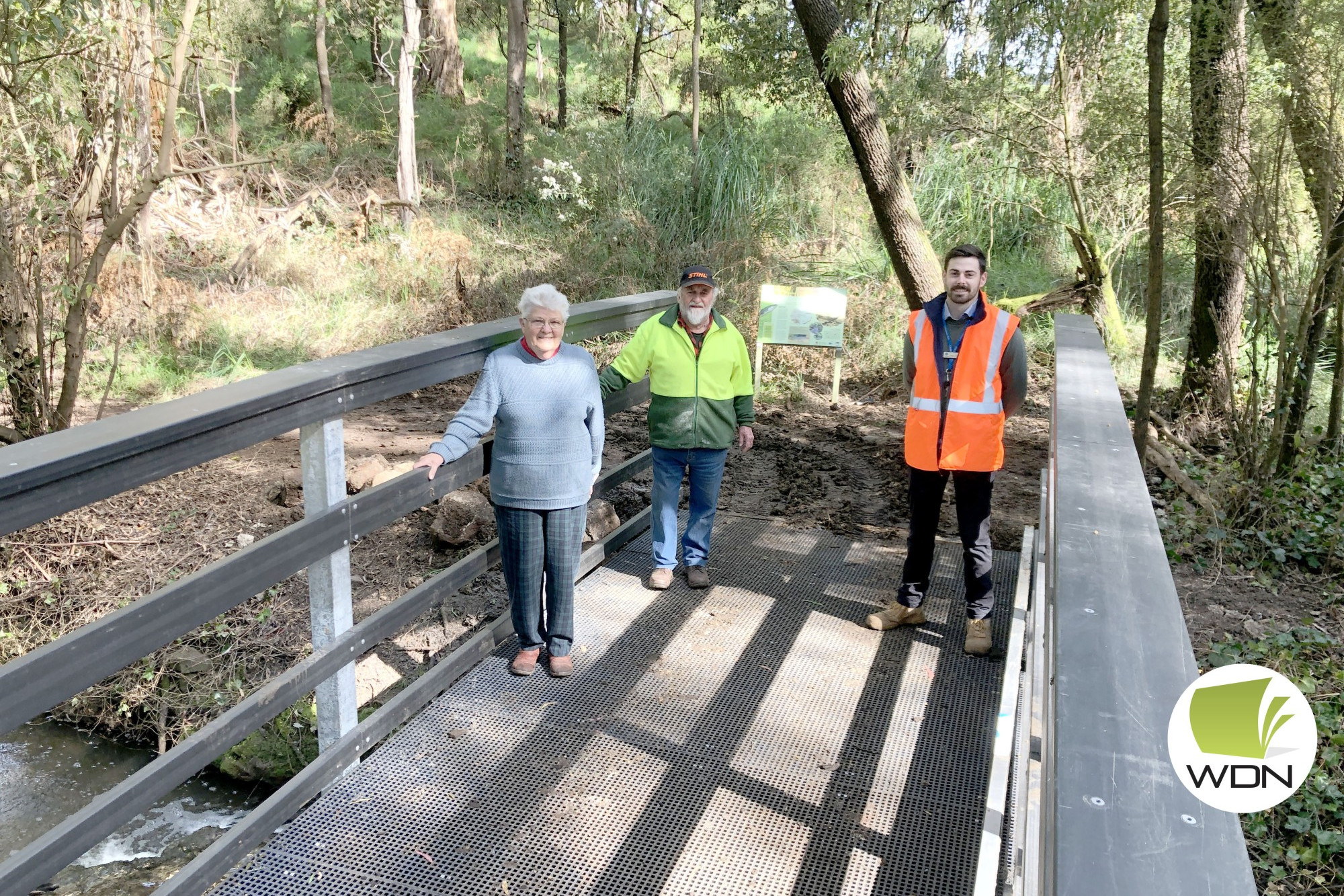 Early open: Camperdown Timboon Rail Trail Committee of Management chairperson Pat Robertson, committee member Greg Farmer and council infrastructure projects officer Dean Finlayson on one of the new bridges.