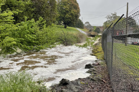 Flood water builds up beside the swimming pool in Cobden. 