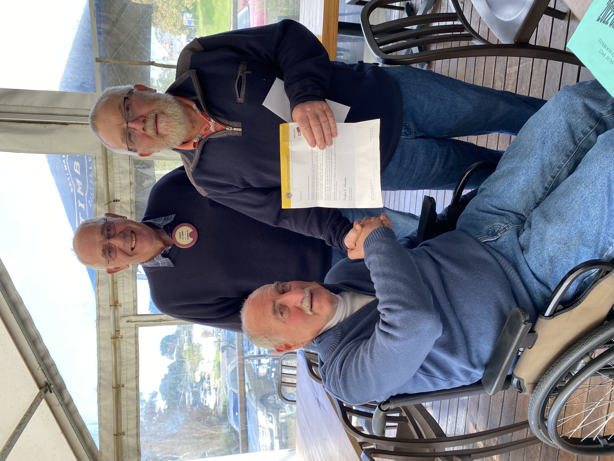Timboon Lions President Ken Ackerley and VP Hans Kruse present John Wilson a long-service acknowledgement on behalf of the then Lions District Governor Tom Blair.