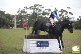 Shay Smith Just Before Dark clear a jump. 