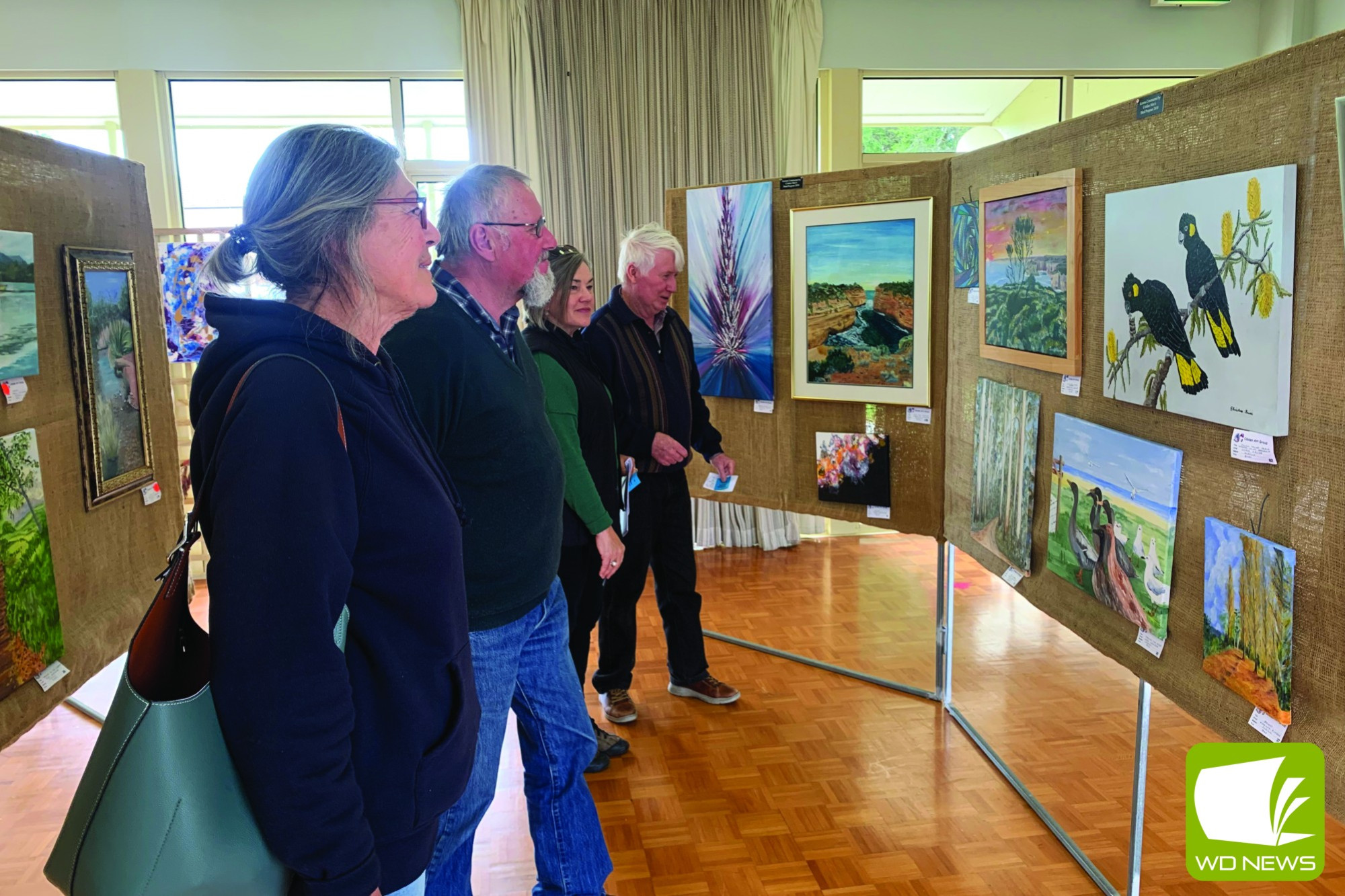 Successful event: Brendan Gleeson, Pauline Pearce, Neville Collins and Jan Barnes browse the art works on display at the Cobden Rotary Club and Cobden Art Group Autumn Show over the weekend.