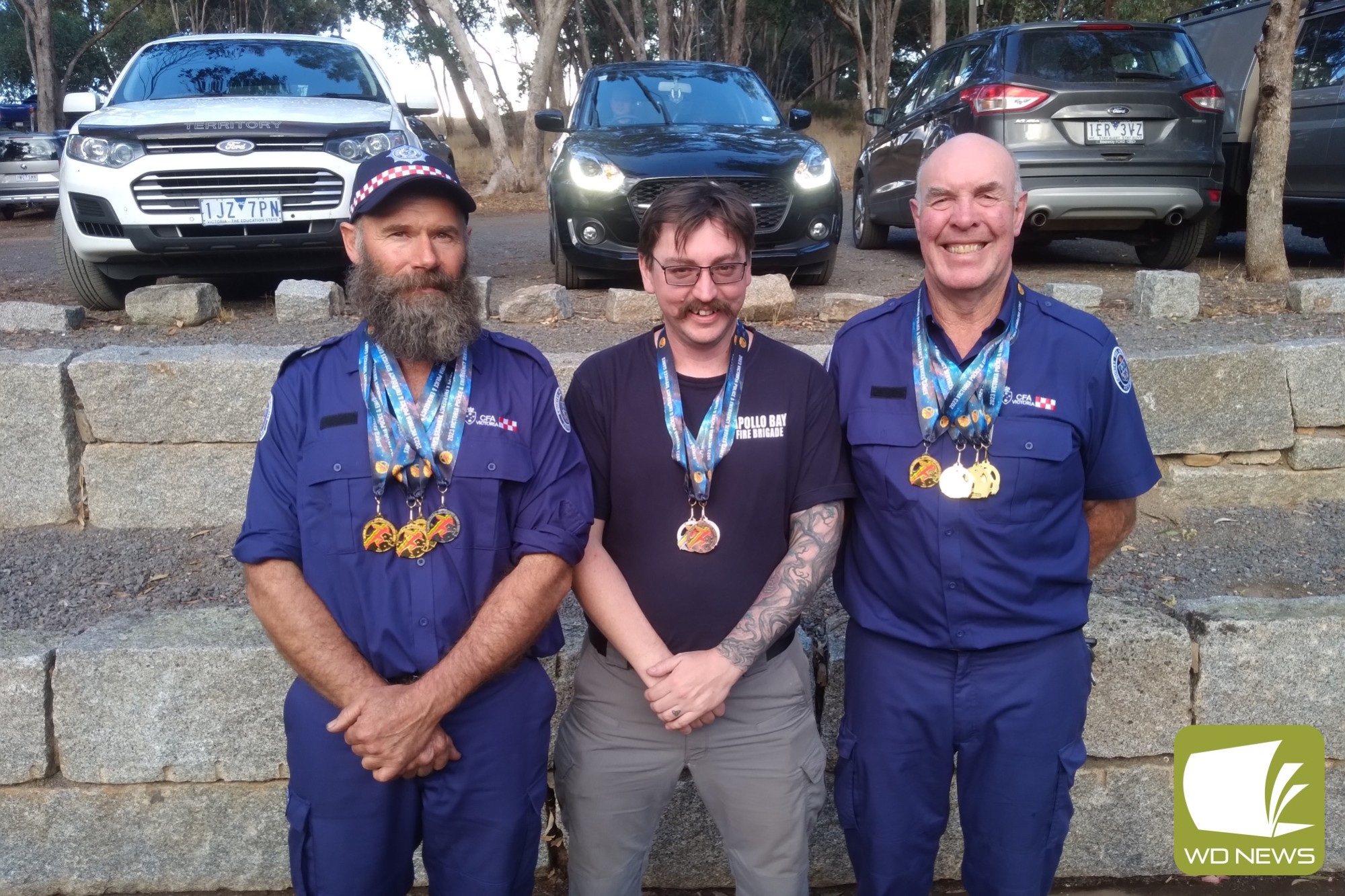 Celebrating success at the games are, from left, Paul Jeffery, Brad Pickering and Mike Evans.