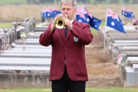 Trumpeter Bernie Dunn plays the last post.