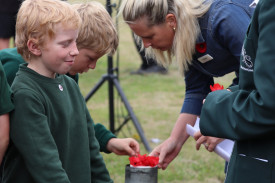 Students were invited to place a poppy following the service.