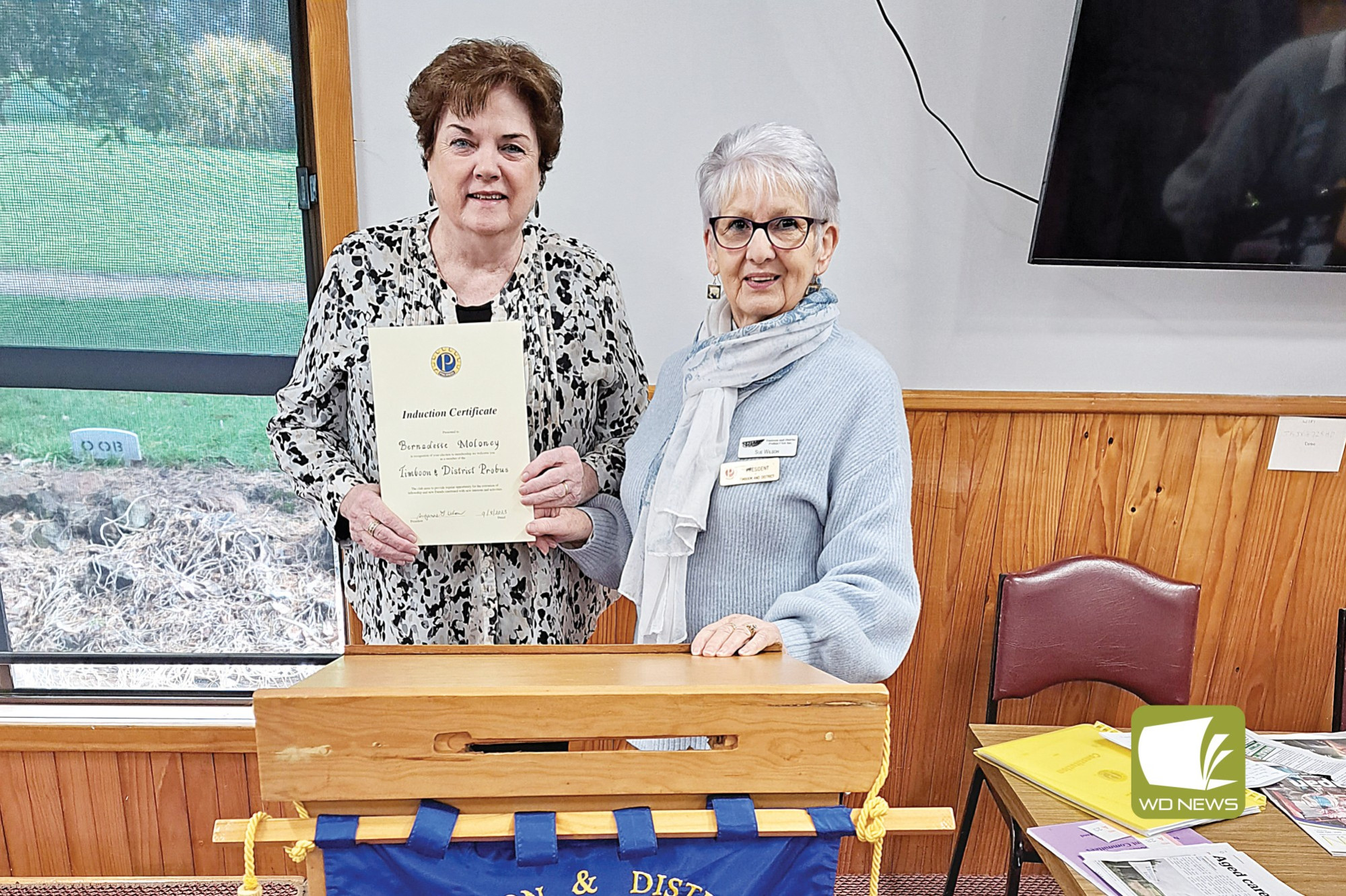 Timboon Probus Club president Sue Wilson (right) installs new member Bernadette Moloney.