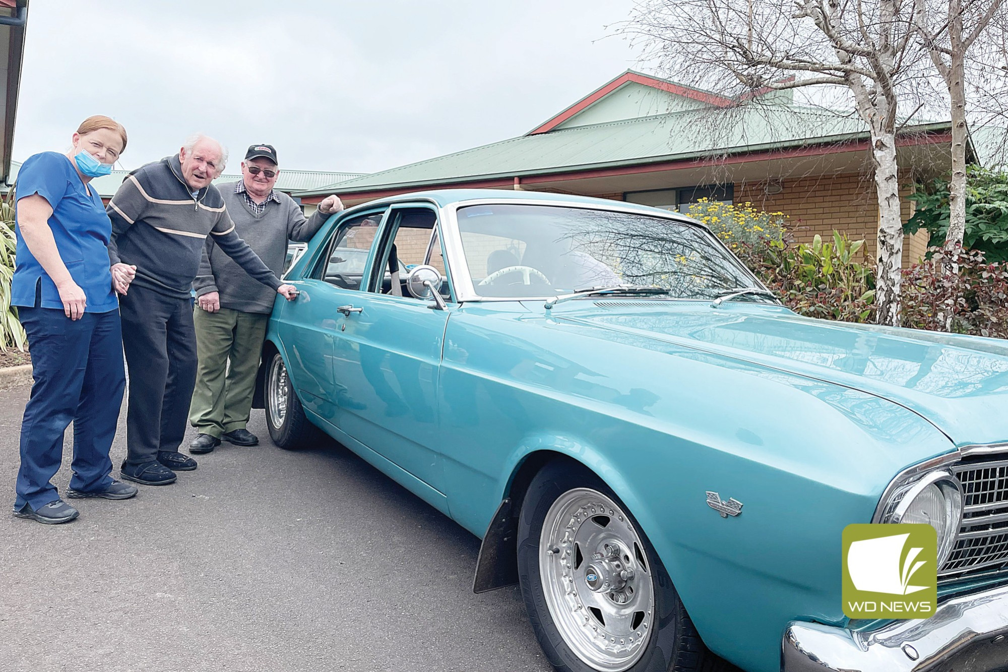 Drive: Cobdenhealth resident Bill had a closer look at vintage cars which took residents on an afternoon drive to Camperdown on Monday.