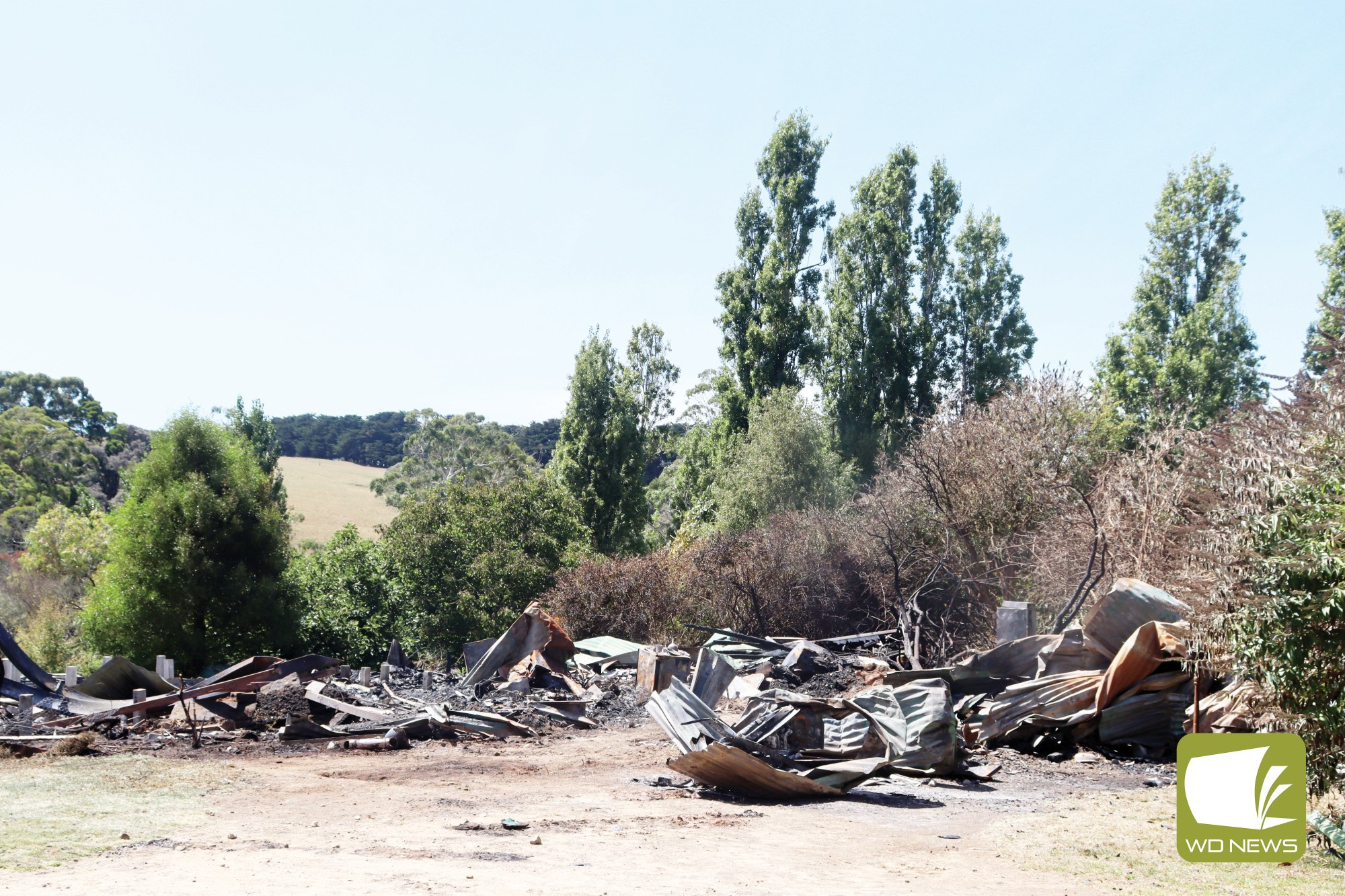 Quick action: Two neighbours swam across the Curdies River to rescue their neighbour after fire tore through her home last week.