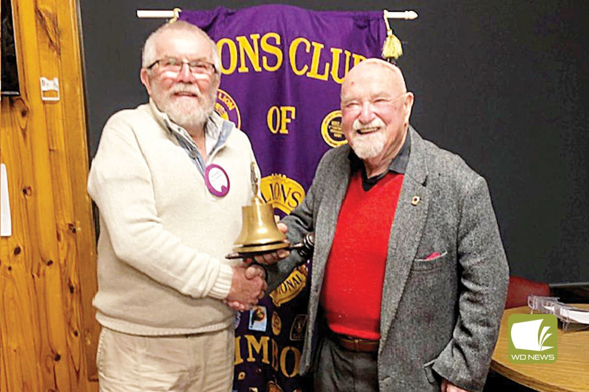 New president: Timboon Lions Club president Ken Ackerley presenting the club's gong and gavel to newly installed president David Gamble.