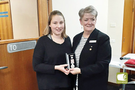 Kate Dwyer accepts accepts a CFA Life Membership on behalf of her father Paul Dwyer from Beth Davidson OAM. 