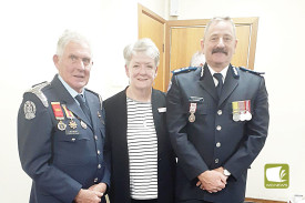 Outgoing Cobden CFA captain Bill Nelson, who received a medal for 50 years of service, with CFA board member Beth Davidson OAM and CFA District 6’s Craig Brittain. 