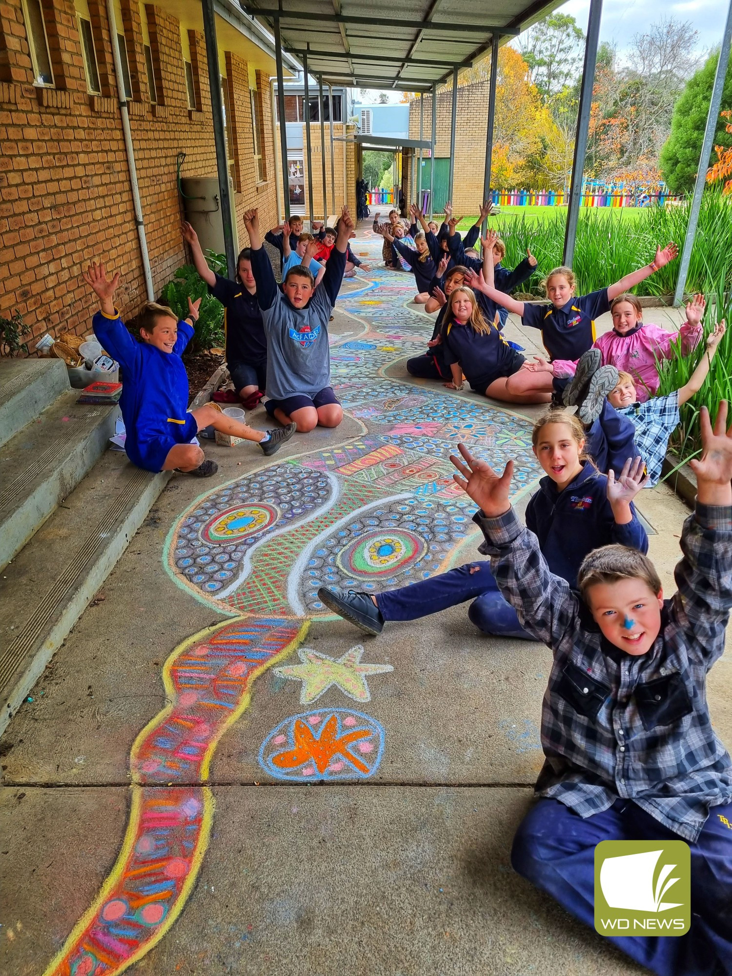 Explosion of colour: There were smiles all round as Timboon P-12 school students helped create a rainbow serpent.