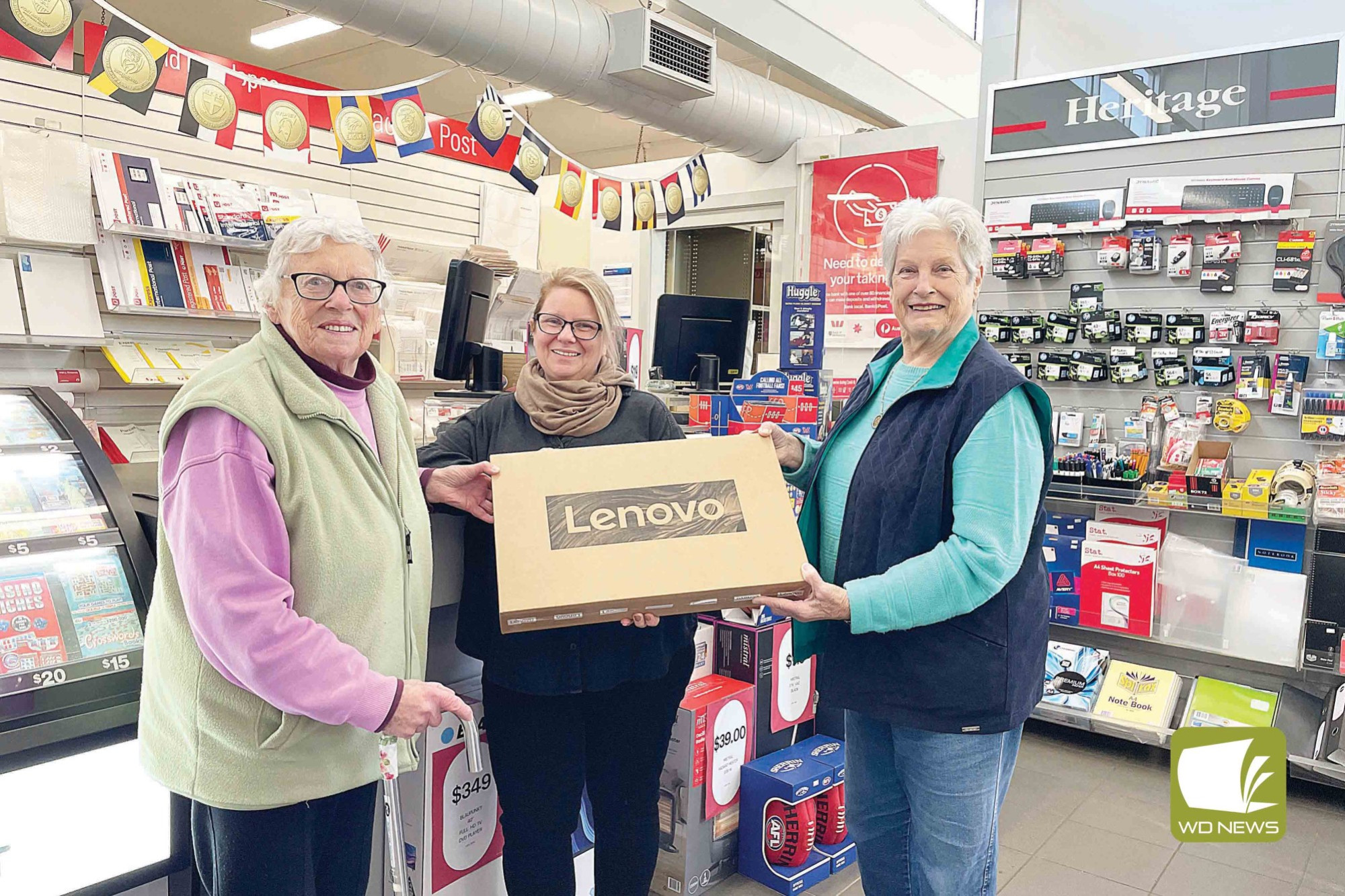Support appreciated: Cobden and District Historical Society members Elizabeth Wilson (left) and Judith Gribble (right) with Cobden Post Office owner Angie Hunter.