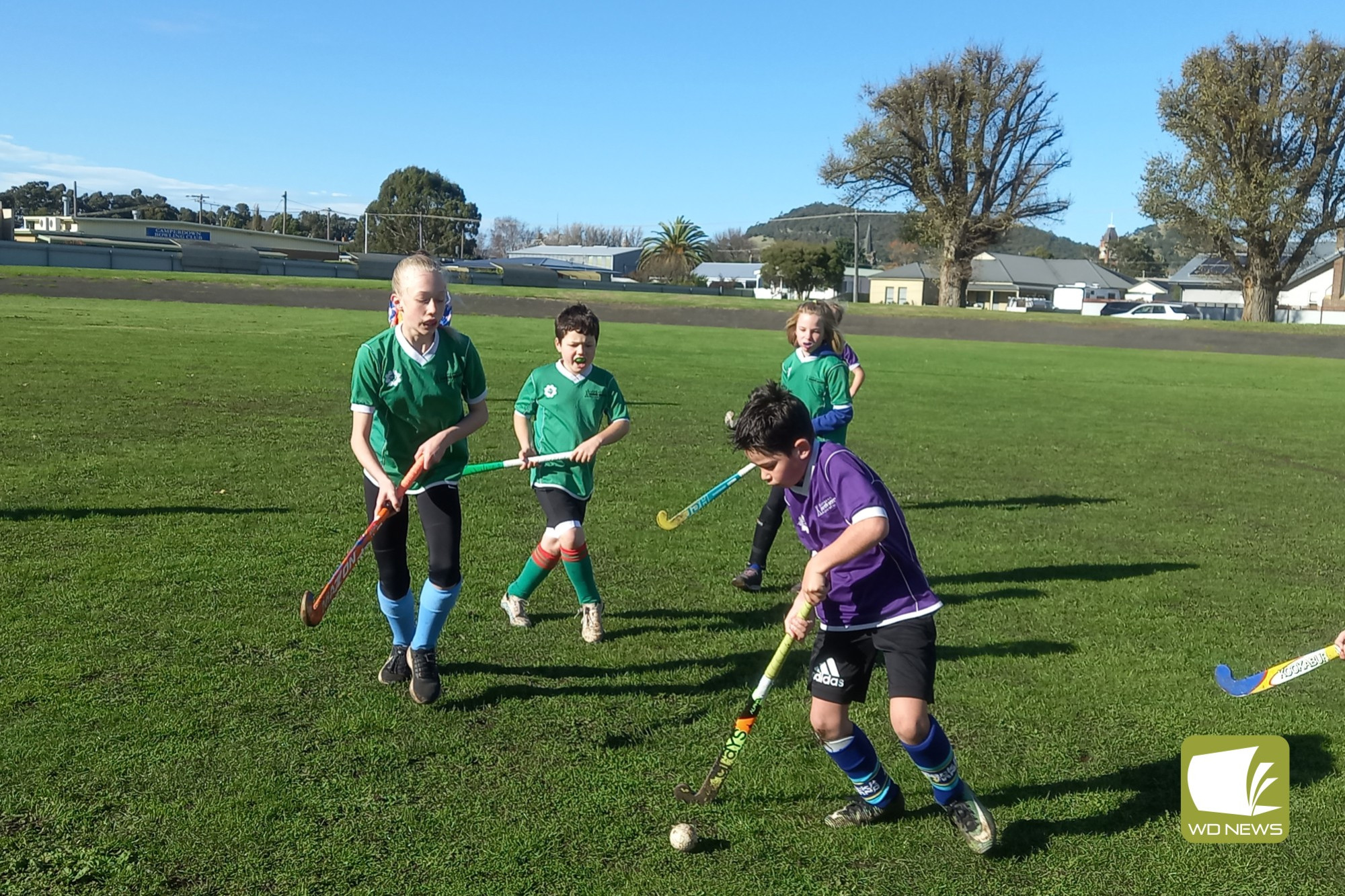 Round eight hockey action - feature photo