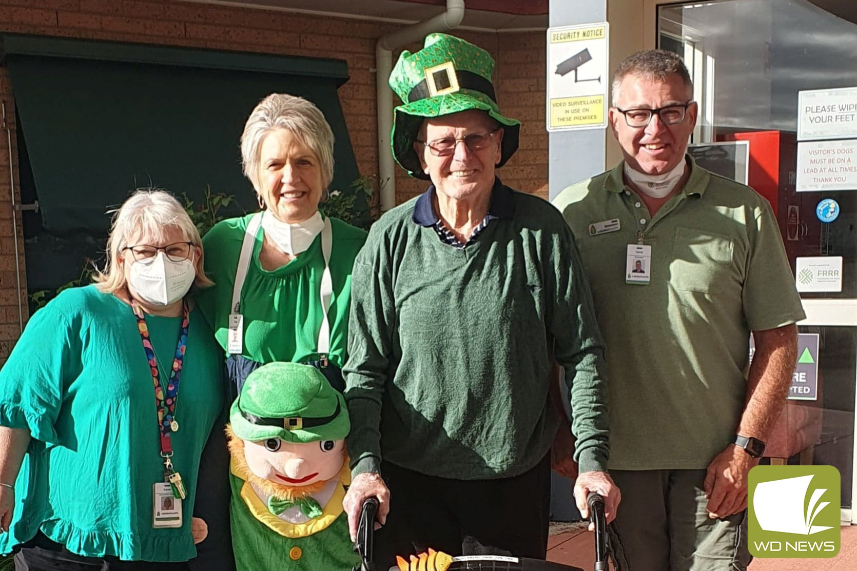 Cobdenhealth staff Karen Price, Sue Loving and Gavin Riches with resident Stan Murfitt dress up for St Patrick’s Day.