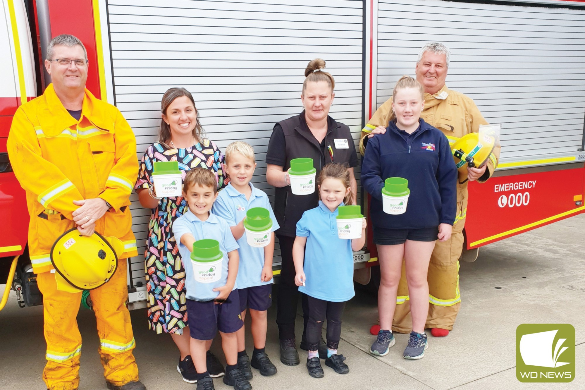 Timboon CFA volunteer Craig Saunders (left) and Daryl Spencer (right) pictured with Sarah Cook, Nelson Cook, Menzel Cook, Sheree Johnstone, Billie Henriksen and Charlotte Taylor are encouraging the community to get involved with the Timboon Good Friday Appeal.