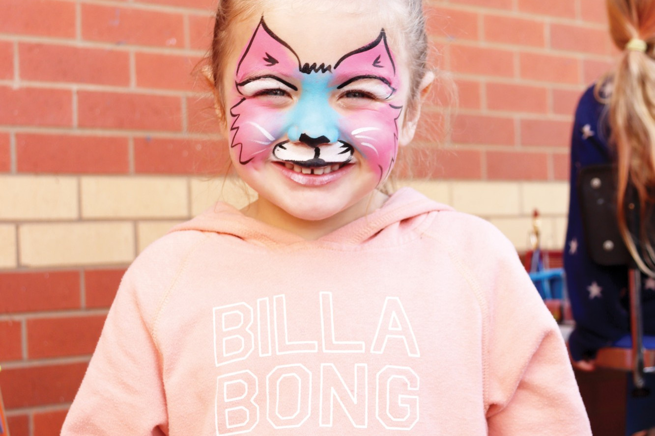 Lulu Burmeister, 4, enjoys getting her face painted.