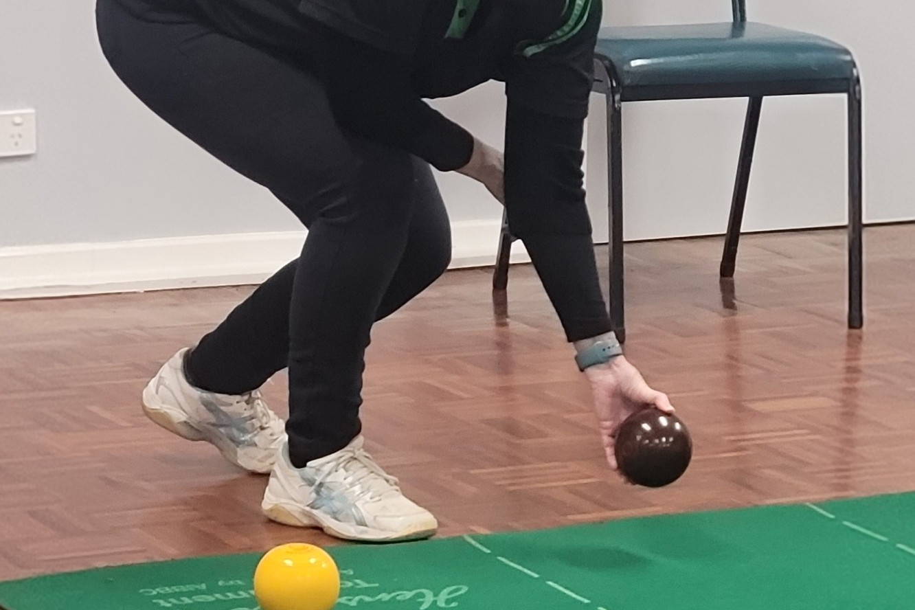 In Division 1, Camperdown 2 Lead Brenda Willis prepares to deliver her bowl.