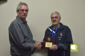 Heytesbury president Max Wines (left) presents Peter Baker (right) with his life membership plaque. 