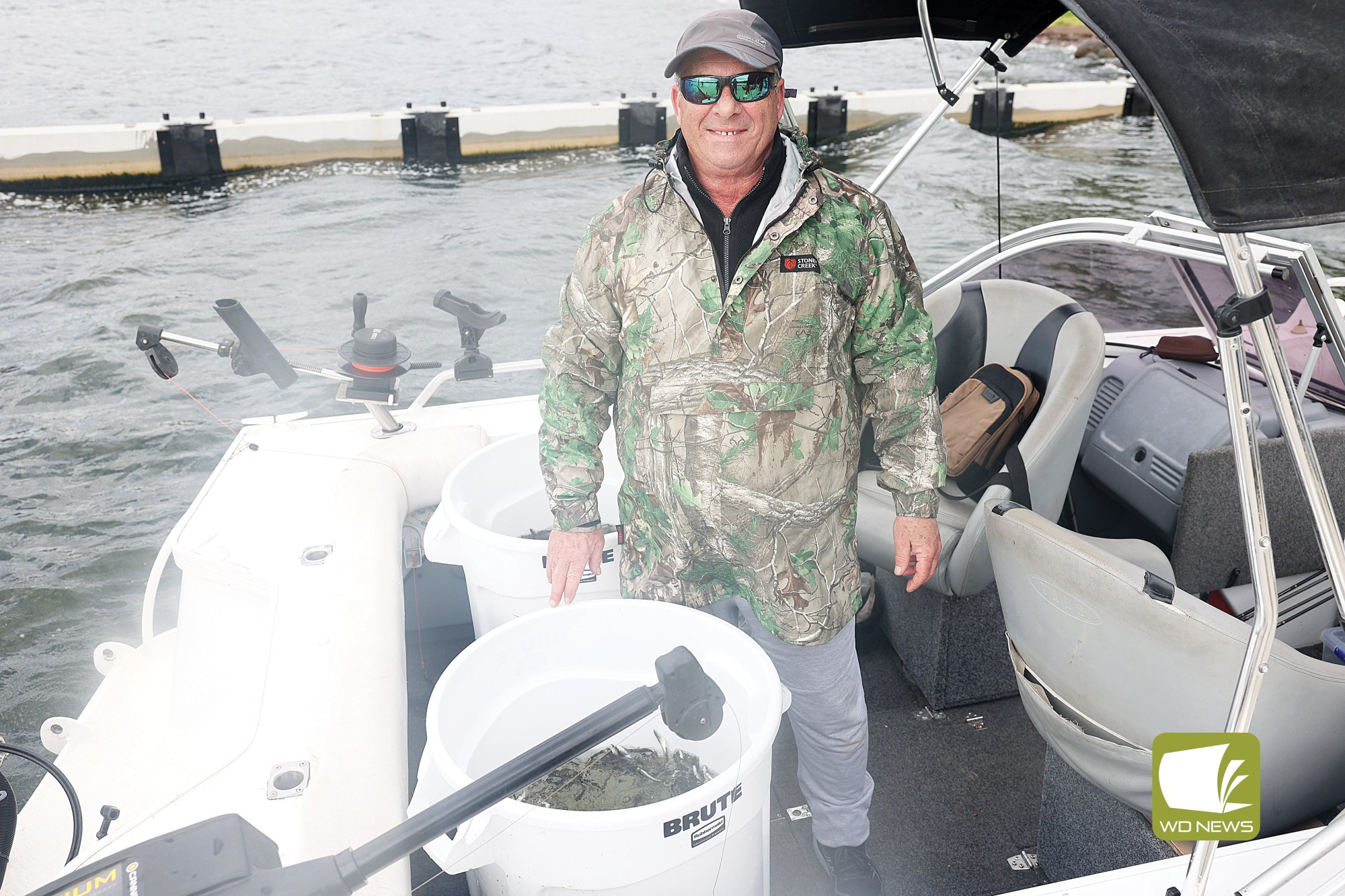 Going swimmingly: Members of Purrumbete and Camperdown Angling Clubs assisted in the VFA Chinook salmon fish release at Purrumbete and Bullen Merri lakes.