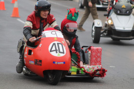 Slick ride: This motorcyclist and his passenger were also a part of the parade. 