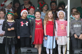 Carols: This group of kids led the rendition of Christmas carols following the parade. 