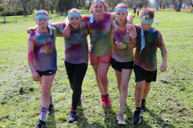 Active fun: Mortlake P-12 College students made their way through the obstacle course, complete with large inflatables and a water slide, during the Rainbow Run.