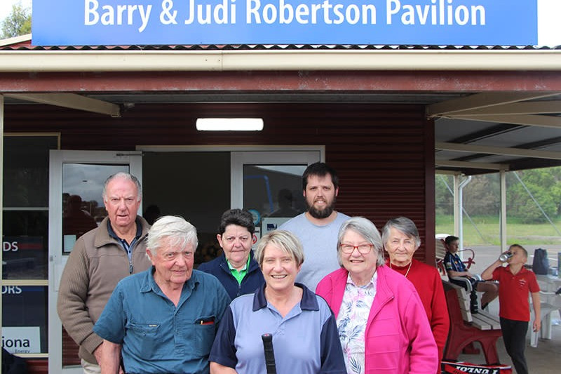 Efforts recognised: Stalwart supporter of the Mortlake Recreation Reserve Committee of Management Judi Robertson received a surprise when she learnt the tennis and netball pavilion would be named in honour of her and her late husband Barry and celebrated the honour with her family.
