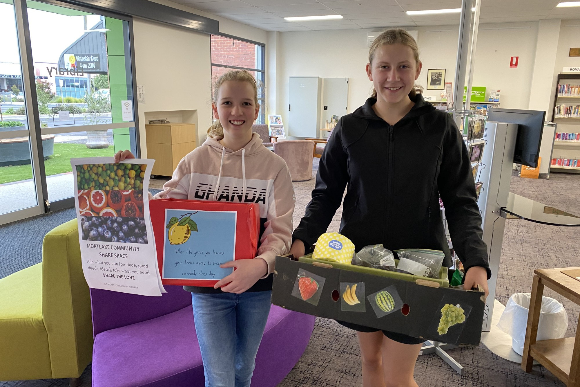 Sharing: Mortlake residents have rallied together to donate share boxes with apples, flowers, toilet paper, noodles and more for those doing it tough during the COVID-19 crisis.