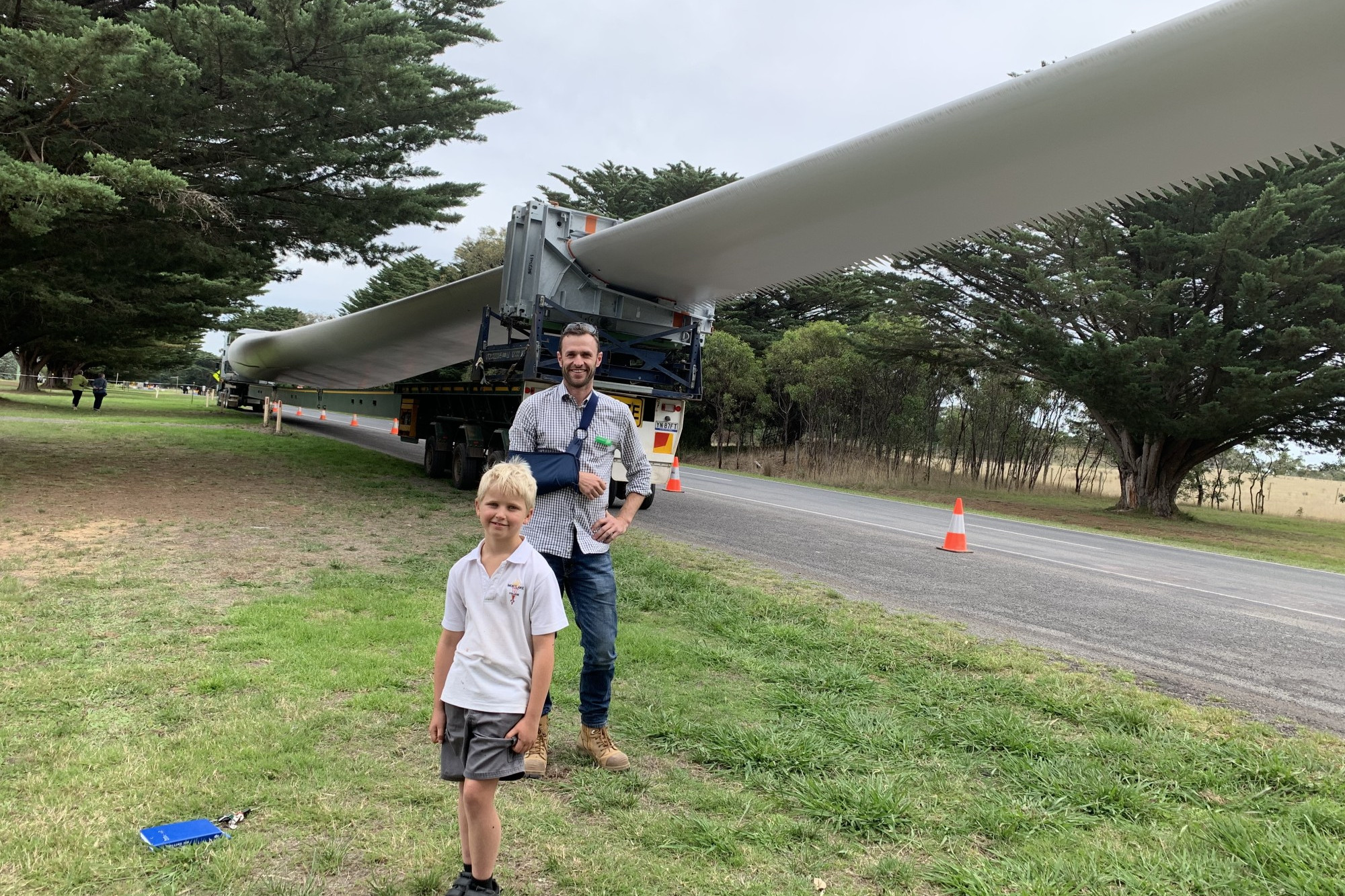 Still going: Dundonnell project manager Matthew Glass and nine year-old Mitchell Leske enjoyed the experience of viewing one of the 73.7 metre wind turbine blades bound for the Dundonnell Wind Farm last month. The wind farm, along with others in the area, are continuing their respective operations but with significant change in the wake of the COVID-19 crisis sweeping the world.