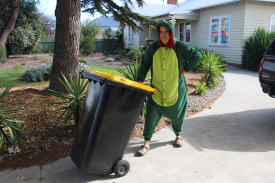 Creative flair: Mortlake’s Jacqui Wilson has dressed up in a variety of costumes, including a dinosaur as part of the Bin Isolation Outing Facebook group. 