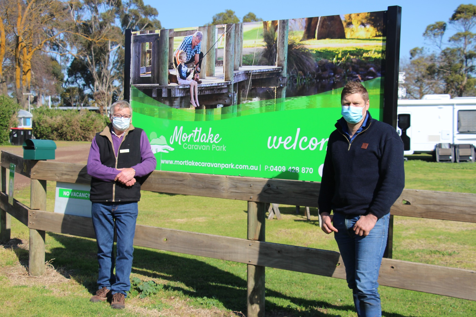 Good news: Mortlake Caravan Park contract caretaker Paul Barker (left) and Moyne Shire Council mayor Daniel Meade have welcomed $360,000 in funding which will go towards five new relocatable cabins for the caravan park.