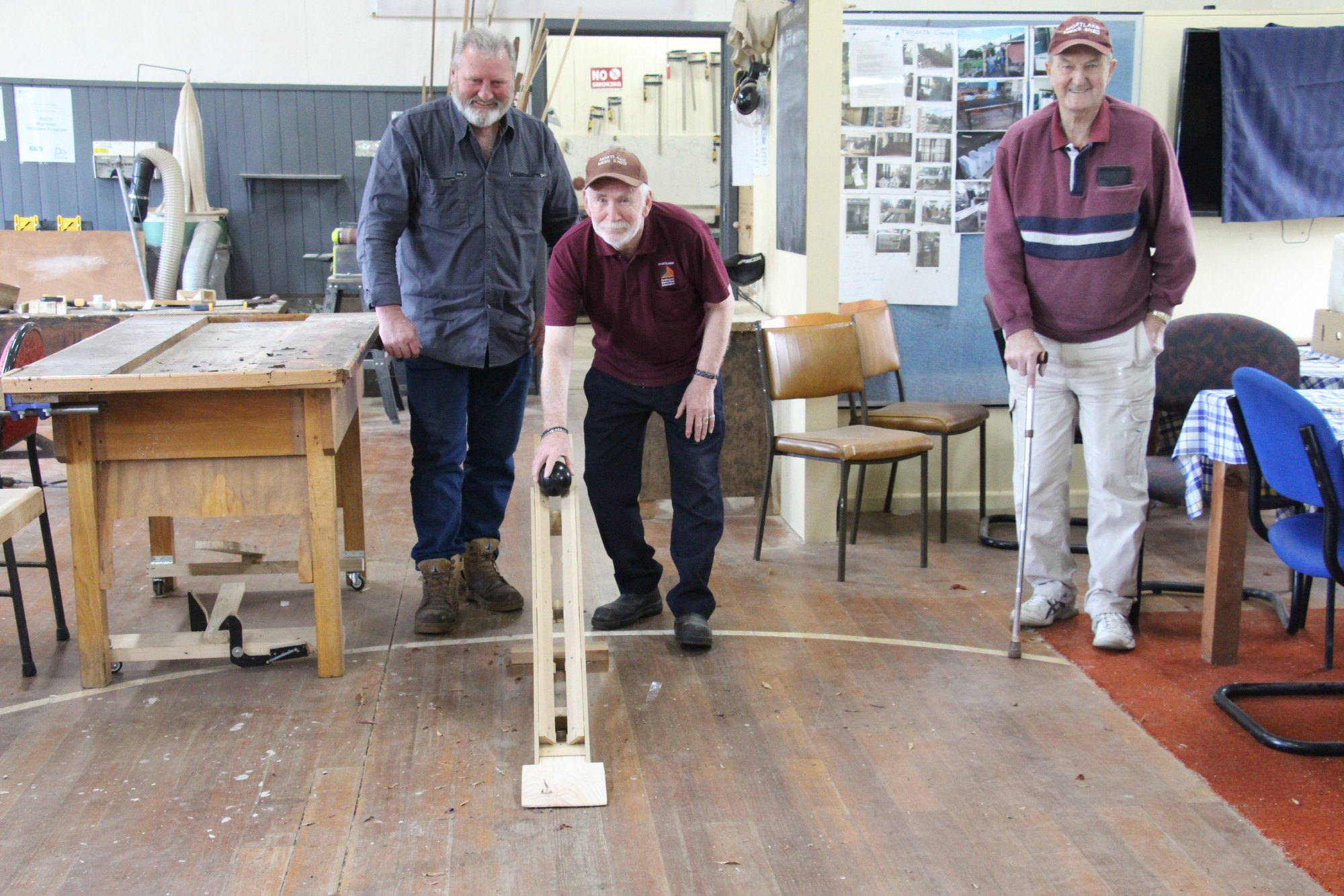 Project move: Mortlake Men’s Shed members Peter Cole (left), Andrew Curwen and Noel Smith show off the indoor carpet bowls ramp they are constructing for Mortlake’s Aberlea residents.