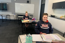 Terang College Year 12s Jorja Cook (back) and Kasey Bant complete classwork. 