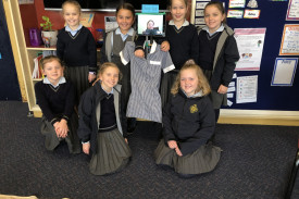 St Colman’s middle school students with a virtual bot of classmate Remy. 