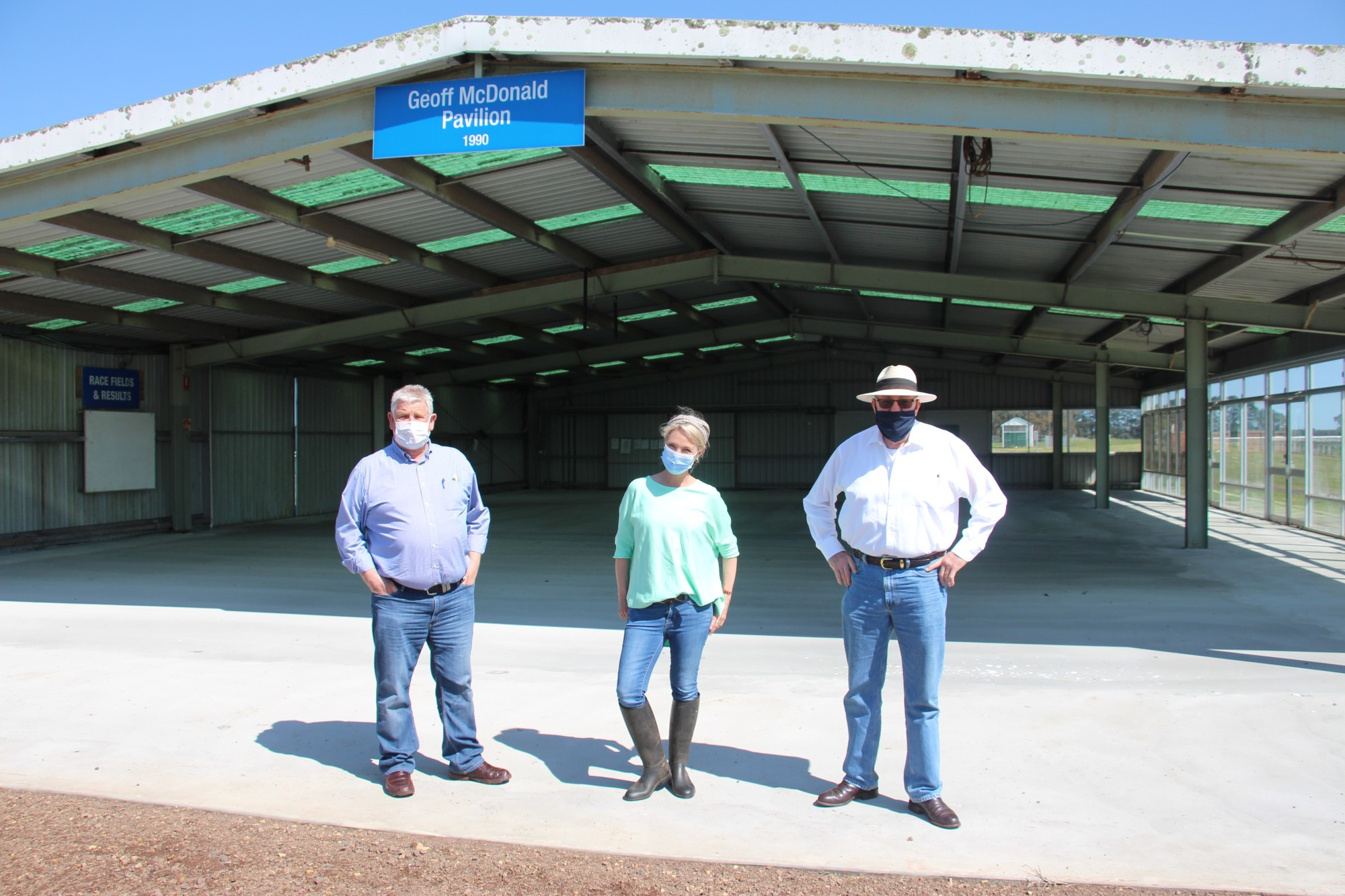 Floor upgrade: Mortlake Racing Club president Bruce Redpath (left), Country Racing Victoria director Victoria Armstrong and Mortlake Racecourse Reserve Committee of Management secretary Mick Murphy show off the recently laid concrete, which will improve the amenity of the Geoff MacDonald Pavilion.