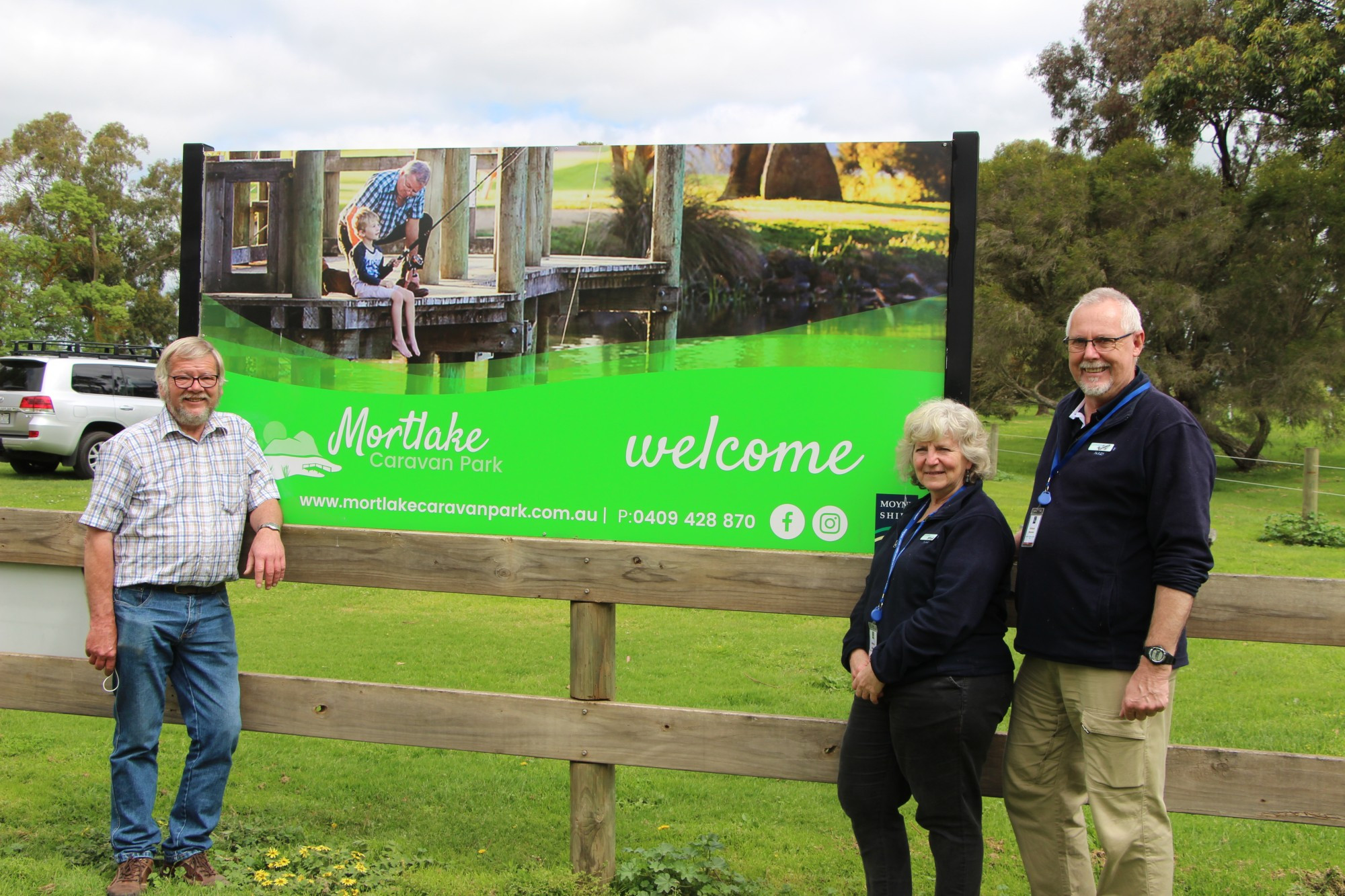New caretakers: Former Mortlake Caravan Park caretaker Paul Barker (left) welcomes incoming caretakers Shirley Angus and Richard Staples to the park.