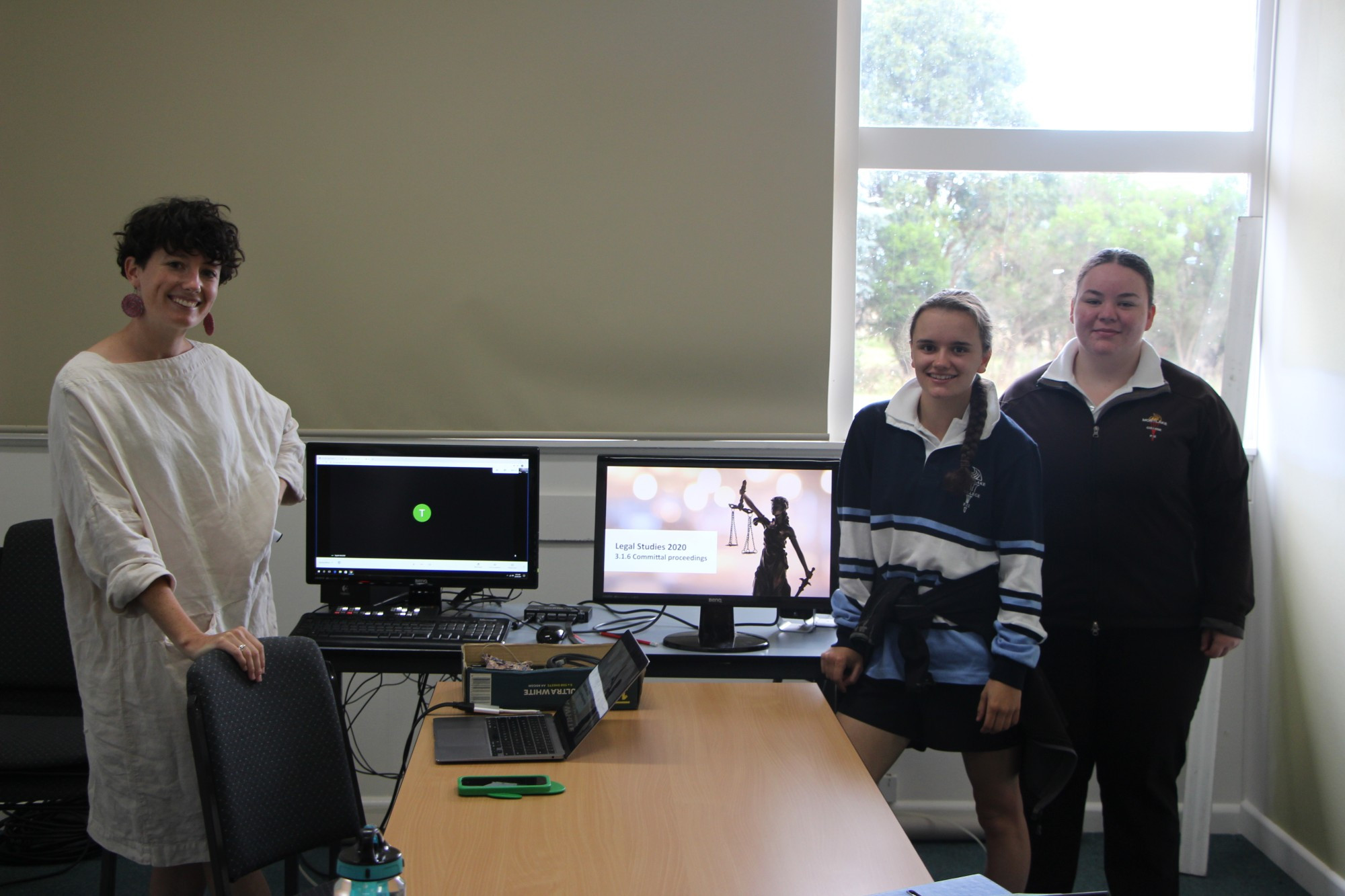 Modern learning: Mortlake College teacher Elise O’Neill (left) helps to deliver an online legal studies module between schools, with Year 12 student Jaime Killen and Year 11 student Katy Jarvie participating.