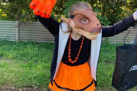 A trick-or-treating dinosaur roamed the streets of Mortlake.