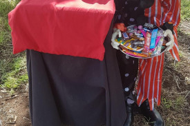 This haunting display featured a clown offering social-distanced treats. 