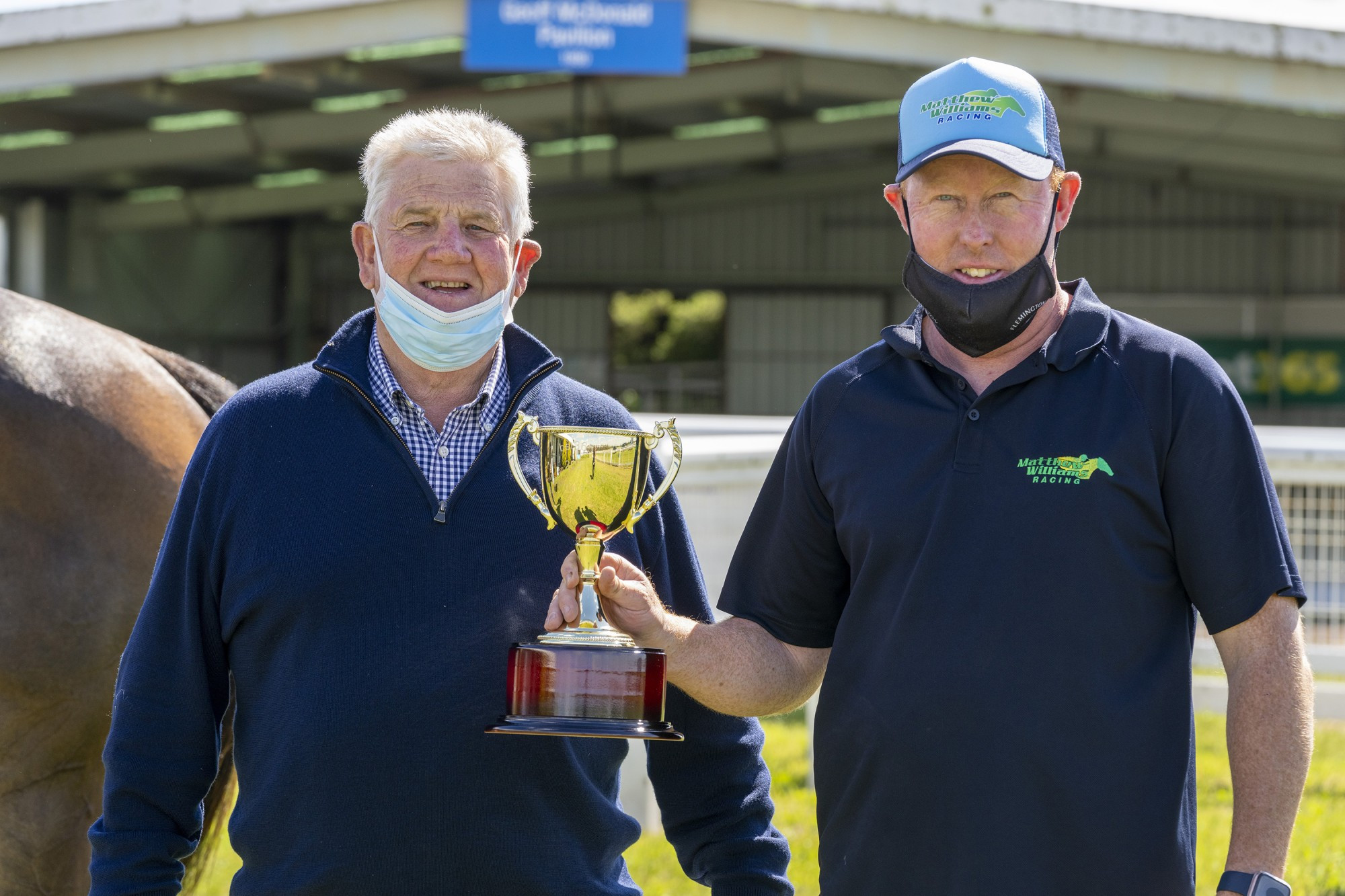 Spoils of victory: Mortlake Racing Club president Bruce Redpath (left) presented winning trainer Matthew Williams with the Mortlake Cup following Seawhatyouthink’s (below) victory on Sunday. Picture supplied by Jay Town/Racing Photos
