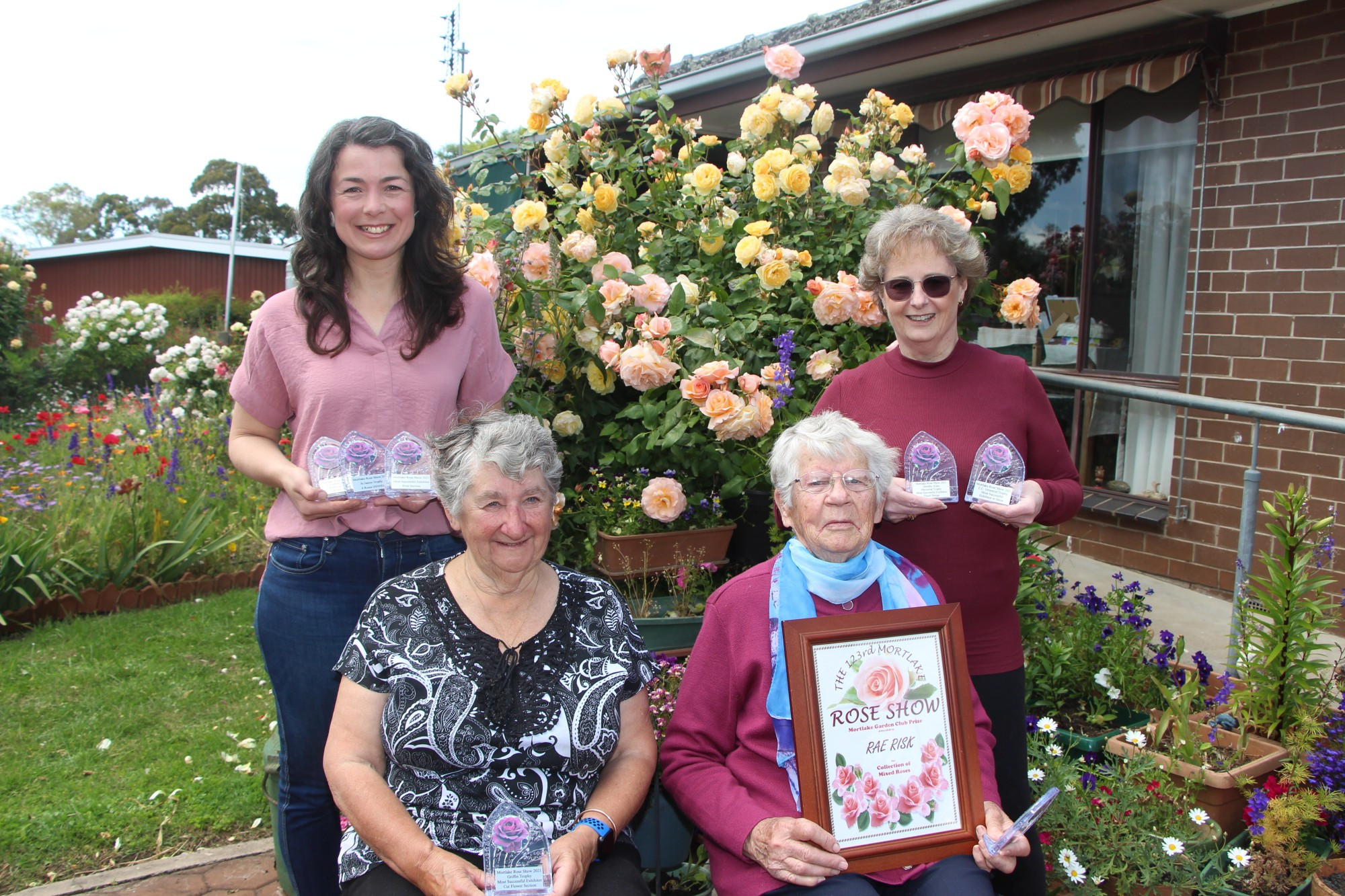 Congratulations: Georgie Oates (from left), Dianne Robertson, Rae Risk and Norma Parker joined to celebrate their success at this year’s Mortlake Rose Show.