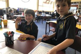 St Colman’s students completing a word search puzzle. 