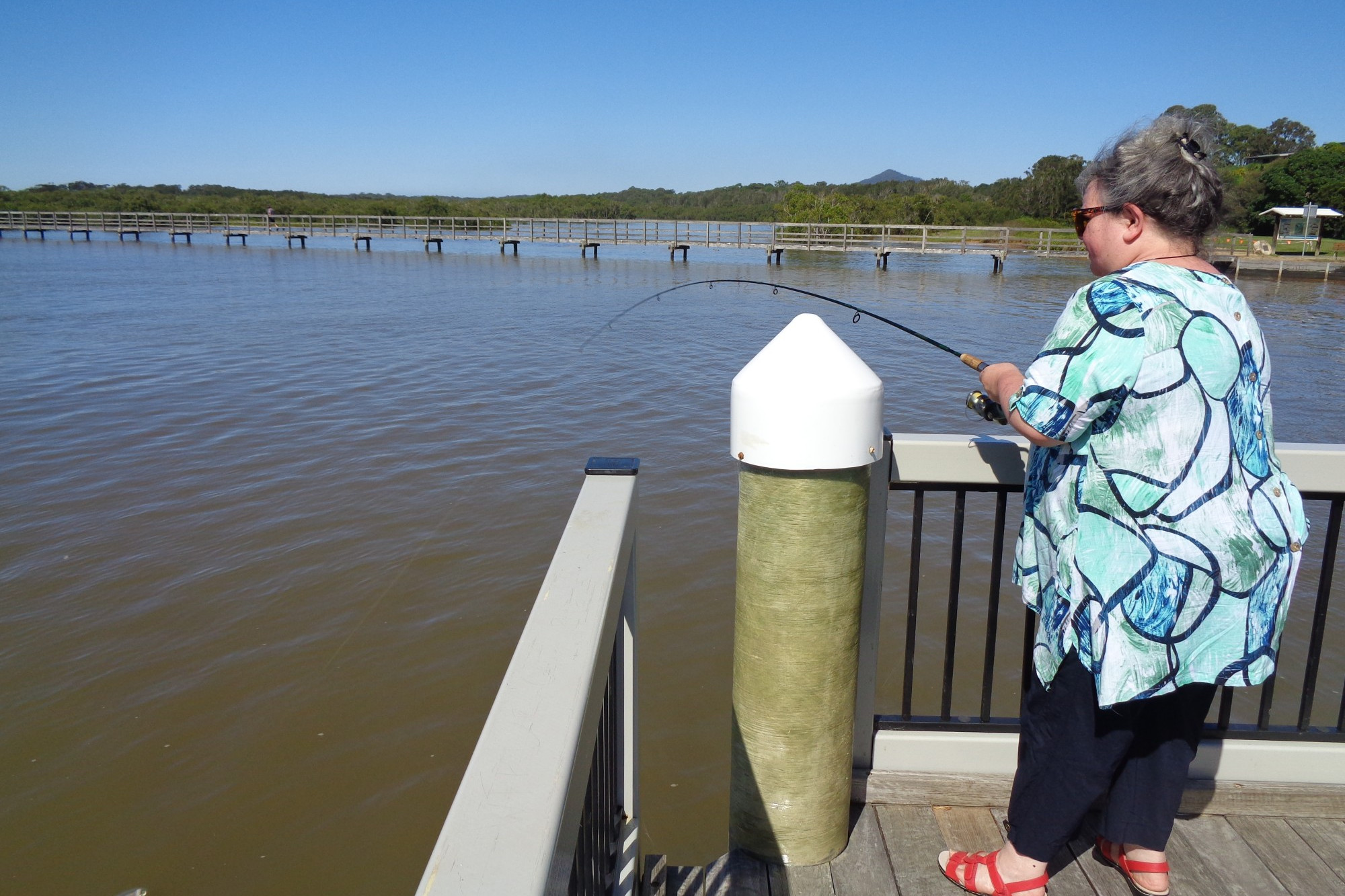 Susan playing with what turned out to be a 35cm yellowfin bream off the Urunga jetty.