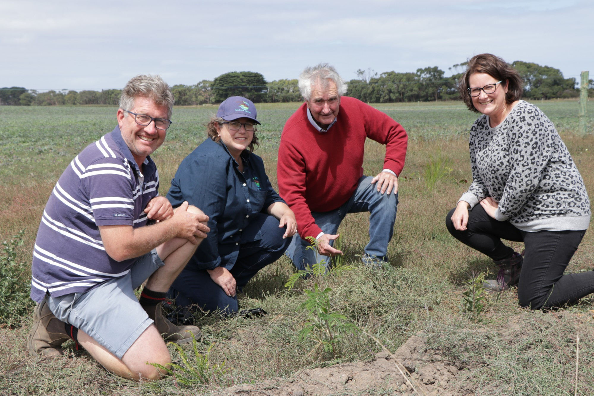 Moyne Shire mayor Ian Smith and Basalt to Bay Landcare facilitator Lisette Mill celebrate increasing biodiversity in Moyne with Nirranda South dairy farmers Tim (Left) and Marie Humphrys (right).